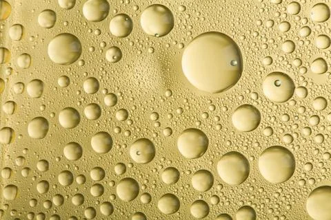 Golden water drops background Stock Photos