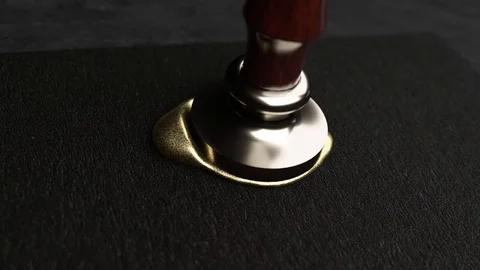 Golden wax drop to black paper and golden stamp make a seal Stock Footage