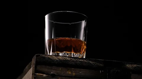 Golden whiskey with ice Stock Footage 112828216