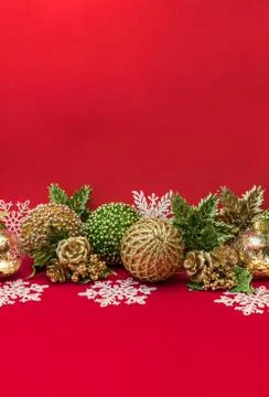 Golden, white and green Christmas decoration on red background Stock Photos