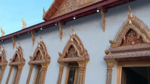Golden windows covered with the finest patterns in traditional Thai style  Stock Footage 308891731