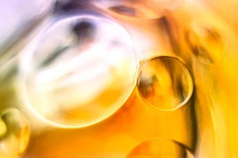 Golden yellow and light pink glass orbs, abstract texture background Stock Photos