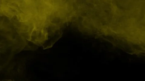 Golden yellow smoke cloud rolling on black background Stock Footage 329029254
