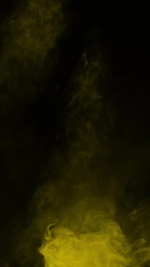 Golden yellow smoke effect on black background, vertical format Stock Footage 340130669