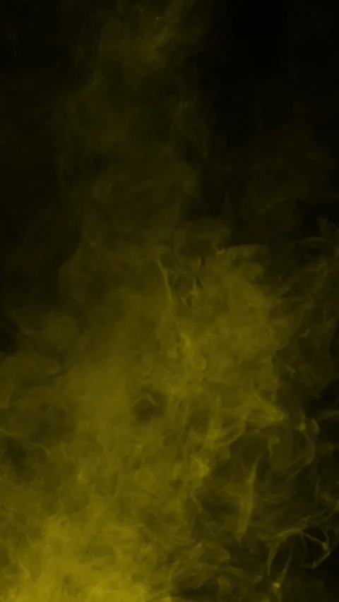Golden yellow smoke effect on black background, vertical format Stock Footage 340134653