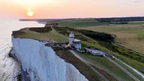 GoldenHour Lighthouse Coastline Drone Stock Footage 344058606