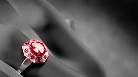 Goldish ring with red ruby jewel on finger, fictitious Stock Footage 195980232