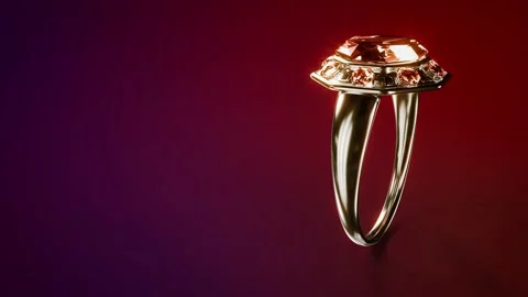Goldish wedding ring with red ruby rotate- background, fictive - loop video Stock Footage 192877812