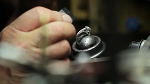 Goldsmith fixing a diamond ring in his shop Stock Footage 8570444