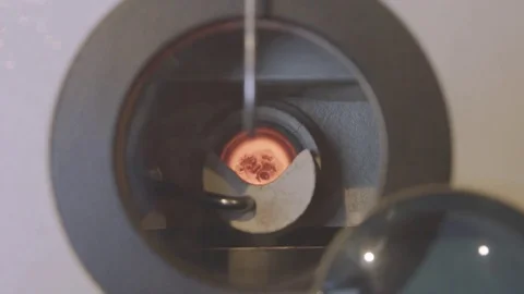 Goldsmith forge gold in machine press cast Stock Footage 82398984