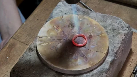 Goldsmith heating silver ring with gas torch before working. Jewelry handicraft Video stock 263828073