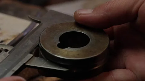 Goldsmith jewelry ring making process ajdusting and polish gold ring Stock Footage 248446681