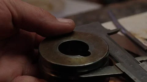 Goldsmith jewelry ring making process ajdusting and polish gold ring Stock Footage 248446886