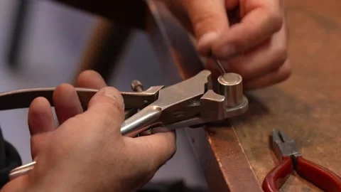 Goldsmith jewelry ring making process ajdusting and polish gold ring Stock Footage 248447132
