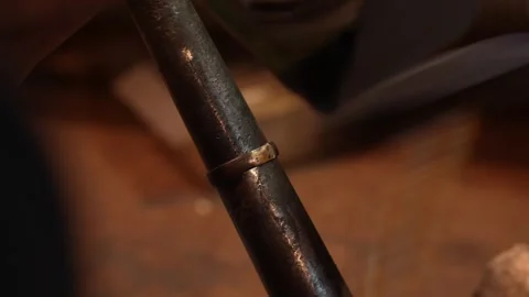 Goldsmith jewelry ring making process ajdusting and polish gold ring Stock Footage 248447136