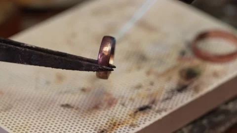 Goldsmith jewelry ring making process ajdusting and polish gold ring Stock-Footage 248447165