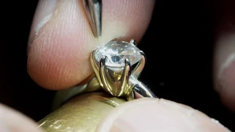 Goldsmith jewelry ring making process ajdusting and polish gold ring Stock Footage 248447215