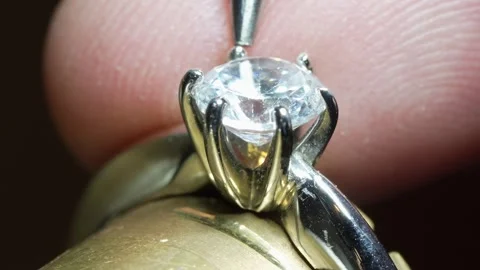 Goldsmith jewelry ring making process ajdusting and polish gold ring Stock Footage 248447217
