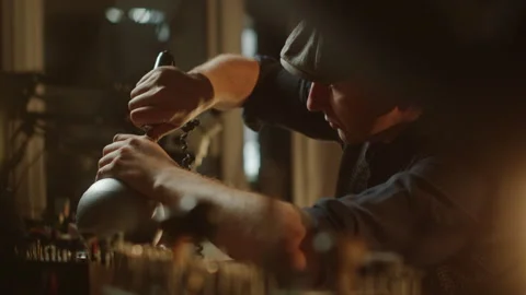 Goldsmith making ring with tools in workshop Stock Footage 260261647