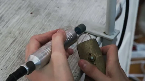 Goldsmith polishing silver ring with buffing machine. Wedding jewelry handicraft Stock Footage 263826309