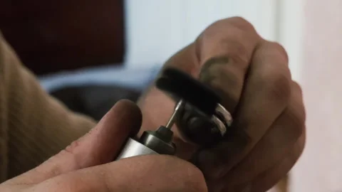 Goldsmith polishing silver ring with buffing machine. Wedding jewelry handicraft Stock Footage 263826359