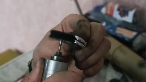 Goldsmith polishing silver ring with buffing machine. Wedding jewelry handicraft Stock Footage 263826459