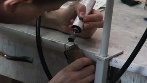 Goldsmith polishing silver ring with buffing machine. Wedding jewelry handicraft Stock Footage 263833415