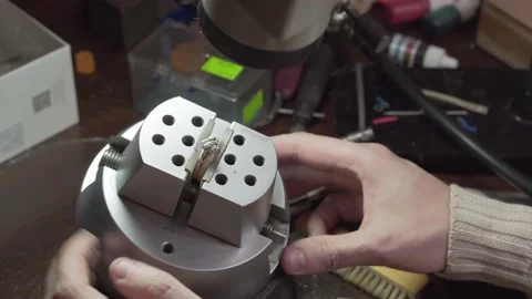 Goldsmith shows the finished silver ring with the beautiful turquoise gemstones. Video stock 147416275