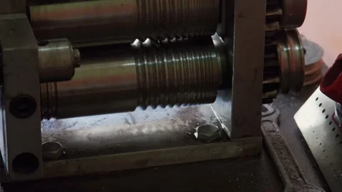 Goldsmith using a press to roll silver ring blank. Close up. Jewelry handicraft Stock Footage 263836097