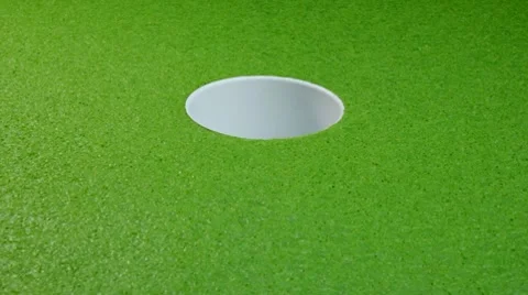 Golf bal goes in the cup Stock Footage 10740539