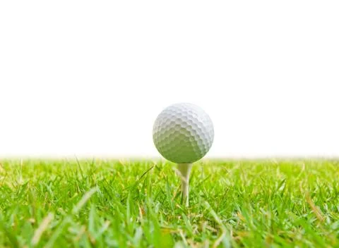 Golf ball and tee grass Stock Photos