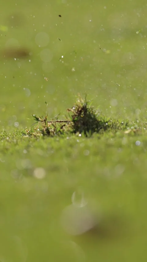 Golf ball being hit by golf club slow motion closeup vertical video Stockbeeldmateriaal 285264026