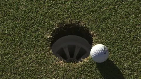 Golf Ball Circling Then Going Into The Hole Video stock 19150697