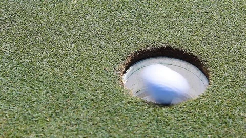 Golf Ball Going into the Cup Stock Footage 116129775