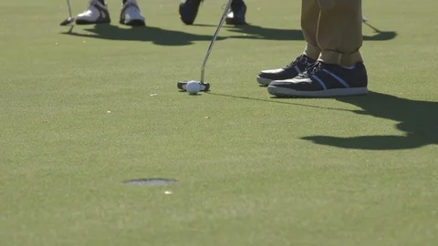 Golf Ball Going Into Hole Stock Footage 76414151