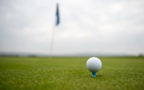 Golf ball on the golf course before hitting the pit Fotos de archivo