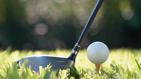 Golf ball on green grass ready to be struck on golf course Stock Footage 126514834