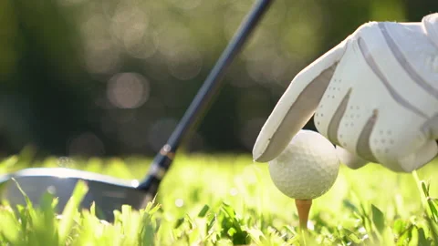 Golf ball on green grass ready to be struck on golf course. Stock Footage 135313402