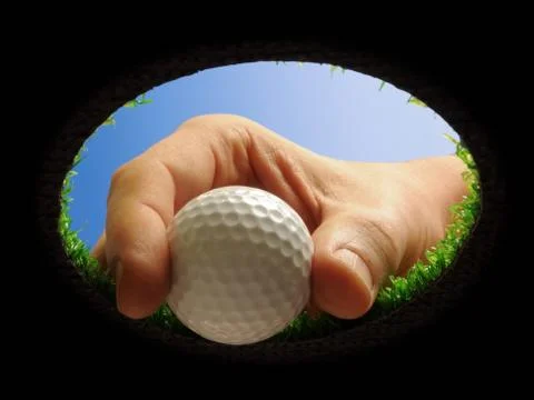 Golf ball with hand Stock Photos