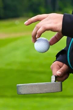 Golf ball in hand Photos