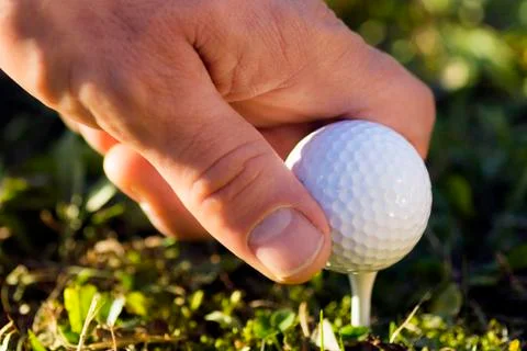 Golf ball in hand Stock Photos