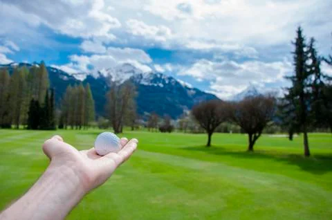 Golf ball on hand Stock Photos