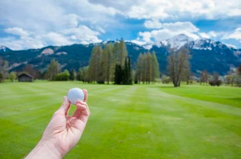 Golf ball on hand Stock Photos