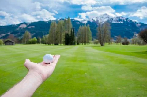Golf ball on hand Stock Photos