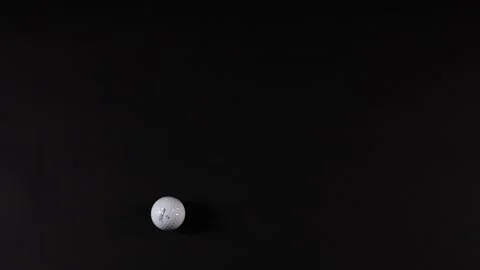 Golf Ball Movement on Black Background Stock Footage 310530600