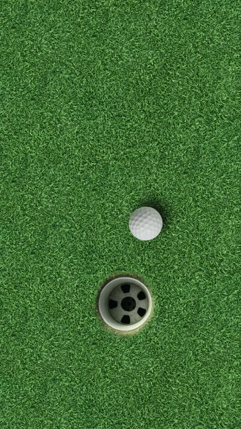 Golf ball next to hole on green grass putting surface sports background Video stock 330119818