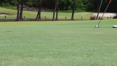 Golf ball pass over the hole Stock Footage 99400356