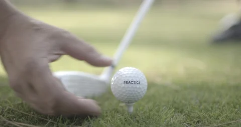Golf ball put on a tee - 2K, AppleProRes 422 Stock Footage 92126588