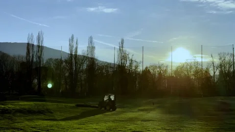 Golf Ball Retrieval Machine at Driving Range with Sunlight and Lens Flare 動画素材 224887638