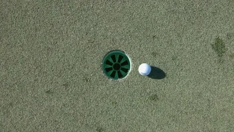 Golf ball rolling in hole Stock Footage 170527835